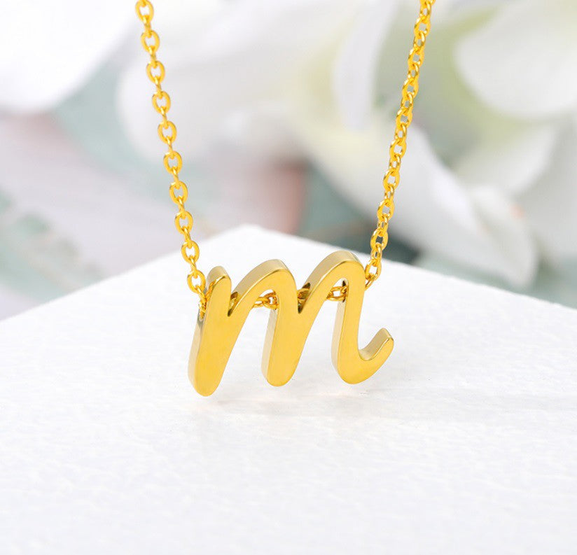 Gold Cursive Initial Letter